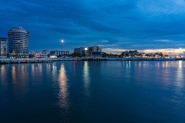 Pattaya, Thailand - September 5 2020 : Market walking area with many street shops and hotels in twilight view from the middle of the sea.
