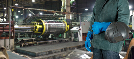 Worker welder at plant closeup photo