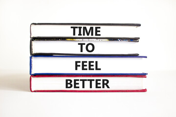 Time to feel better symbol. Concept words Time to feel better on books. Beautiful white table white background. Motivational business time to feel better concept. Copy space