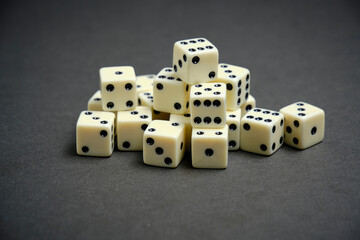 Bunch of ivory dice on black background.