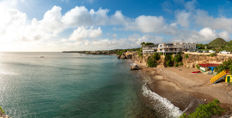 Obraz premium Turquoise beach in front of a small cliff on the island of Curacao. Netherlands Antilles. 
