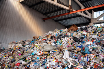 Heap of plastic garbage at waste sorting plant