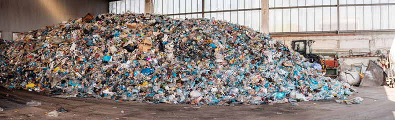 Heap of plastic garbage at waste sorting plant