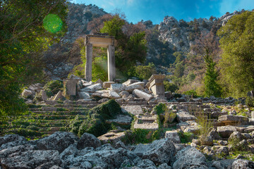Obraz premium Arch of Hadrian's Temple in ancient abandoned city Termessos in mountains Antalya region, Turkey