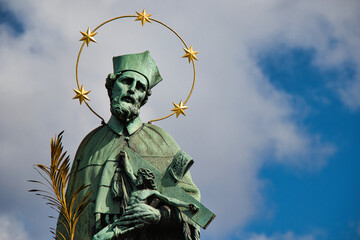Statue of St. John of Nepomuk on Charles bridge, Prague. Czech Republic.