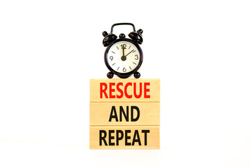 Rescue and repeat symbol. Concept words Rescue and repeat on wooden block on a beautiful white...