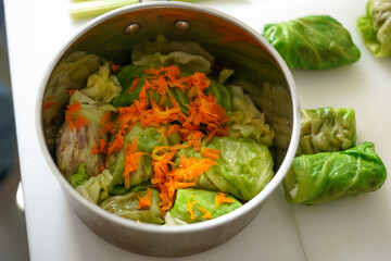 preparing traditional Ukrainian cabbage rolls with vegan minced meat in cabbage leaves. Homemade recipes