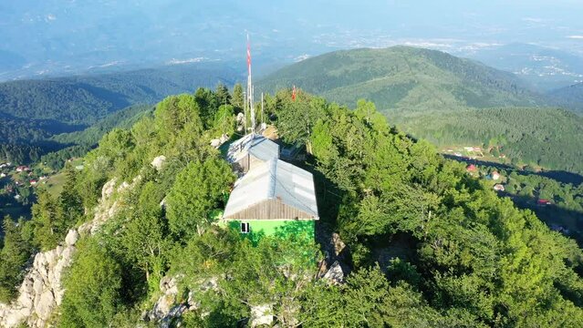 Turning around the Peak of Keremali Mountain and its Tomb. A small mosque and a mausoleum on small plain at summit. In middle of August, commemoration ceremonies and plateau festivals are held

