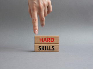 Hard skills symbol. Wooden blocks with words Hard skills. Beautiful grey background. Businessman hand. Business and Hard skills concept. Copy space.