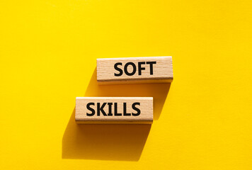 Soft skills symbol. Wooden blocks with words Soft skills. Beautiful yellow background. Business and Soft skills concept. Copy space.