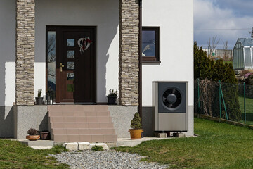 Economic heat pump in modern passive house using green energy, future of heating concept - obrazy, fototapety, plakaty