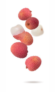 Isolated exotic fruit. Lychee fruits falling down with clipping path as package design element. Full depth of field. Food levitation concept. Fresh fruits.