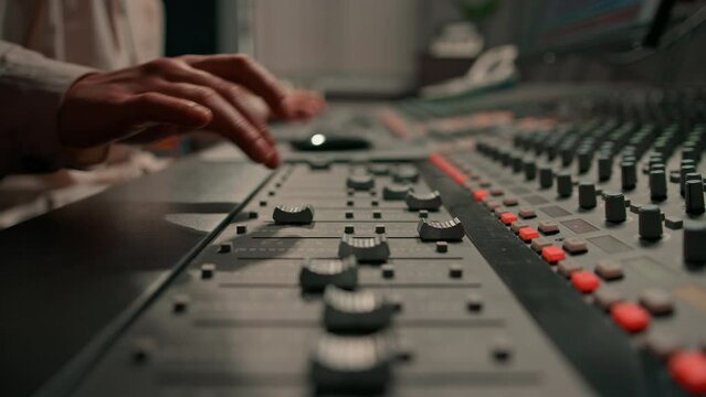 Sound engineer used digital audio mixer Sliders Engineer presses keys Control panel Recording studio technician