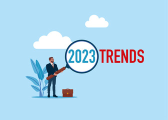 Magnifying glass magnifies 2023 trends. Modern vector illustration in flat style