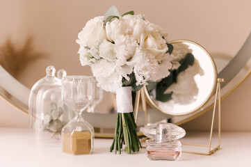 The bride's bouquet and the beautiful details of the bride's morning