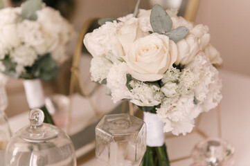 The bride's bouquet and the beautiful details of the bride's morning
