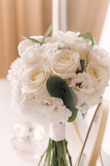 The bride's bouquet and the beautiful details of the bride's morning