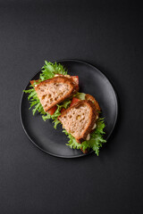 Delicious caprese sandwich with grilled toast, mozzarella, lettuce and tomatoes