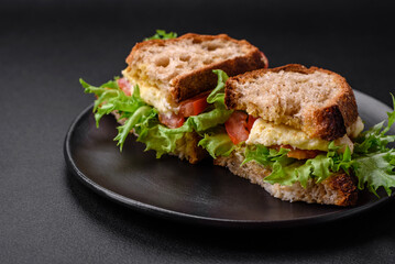 Delicious caprese sandwich with grilled toast, mozzarella, lettuce and tomatoes