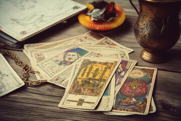 Fototapeta na wymiar Generative ai Tarot cards on fortune teller old desk background