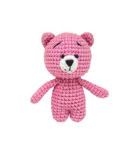 Teddy bear knitted crochet isolate on a white background. Selective focus.