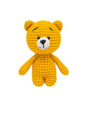 Teddy bear knitted crochet isolate on a white background. Selective focus. Baby. - obrazy, fototapety, plakaty
