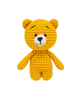 Teddy bear knitted crochet isolate on a white background. Selective focus. Baby.