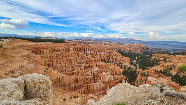 Panoramic aerial view of massive hoodoo sandstone rock formations in Bryce Canyon National Park, Utah, USA. Natural unique amphitheatre sculpted from the reddest rock of the Claron Formation. Awe