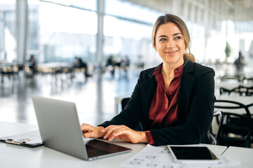 Positive gorgeous successful influential caucasian business lady, in elegant clothe, director of...