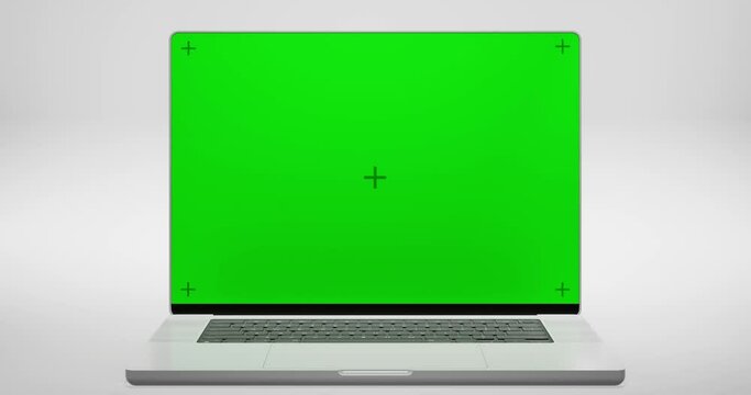 Green Screen Display Laptop Opens On A White Background. Empty Green Mock-Up Monitor For Video Call, Website Template Presentation Or Game Applications. Blank Screen Monitor 3D Render

