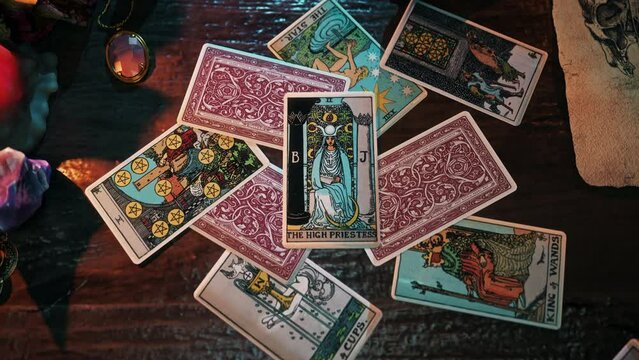 Marseille, France - May 9, 2019. Predicting possible fortune in a paranormal ritual. Interpreting The High Priestess Card in a paranormal fortune telling ritual. Paranormal fortune divination ritual.