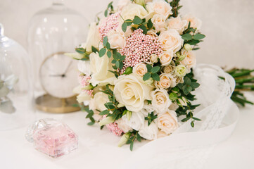 The bride's bouquet and the beautiful details of the bride's morning