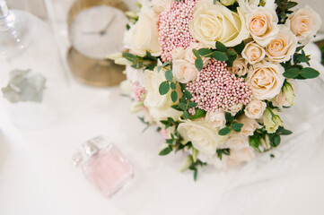 The bride's bouquet and the beautiful details of the bride's morning