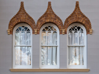 Pretty Venetian Renaissance style windows with red brick detail in side wall of the 1889 Flagler...