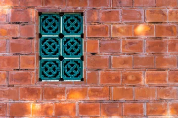 Fotobehang Chinese style window over the red brick wall building © leungchopan