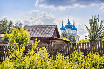 Cathedral of the Annunciation with blue domes and a log house, Gorokhovets