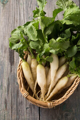 white long radish in a wicker basket