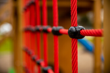 climbing net in children's playground , red rope Childrens playground in the city park. ,