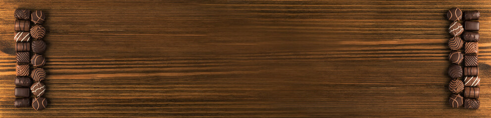Bonbon Chocolate Pralines Texture Background, Cocoa Candies Banner, Chocolate Praline on Black