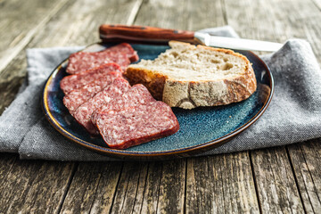 Smoked .sausage. Sliced salami on plate.