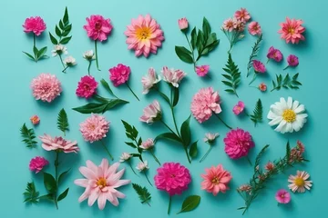Schilderijen op glas Blooming Beauty: Flatlay of Different Pink Flowers on a Cyan Background © Anne