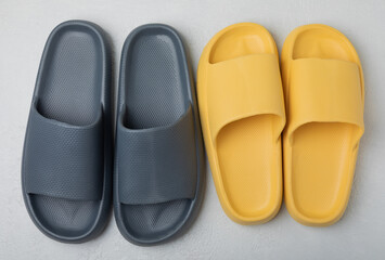 Home slippers on a white texture background. Indoor shoes. Flatley. Home cozy slippers for comfort. Close-up. Place for text. Copy space.