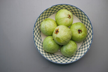 close up of slice of guava on table 