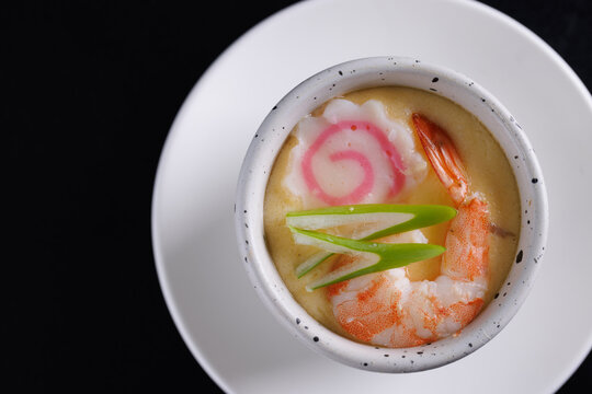 Japanese Traditional food Eggs Custard Chawanmushi isolated in black background
