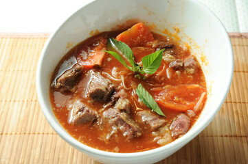Shrimp Head Paste Seafood Hot and Sour Soup served in bowl isolated on table top view of Soup powder