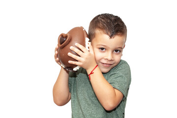 happy little boy with easter chocolate egg on light background