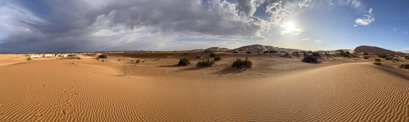 Fototapeta na wymiar Merzouga, Morocco, Africa, panoramic view of the dunes in the Sahara desert, grains of sand forming small waves on the beautiful dunes before sunset 