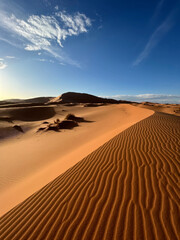 Merzouga, Morocco, Africa, panoramic view of the dunes in the Sahara desert, grains of sand forming...