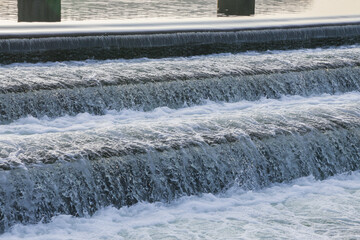 Cascade of water in the reservoir flowing down.