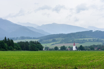 church tower on the background of the tatra mountains